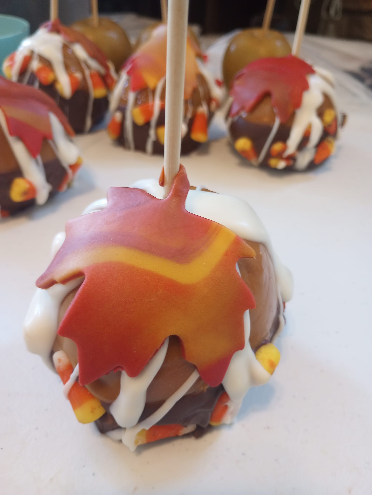 orange, brown and white themed caramel apples for the holidays